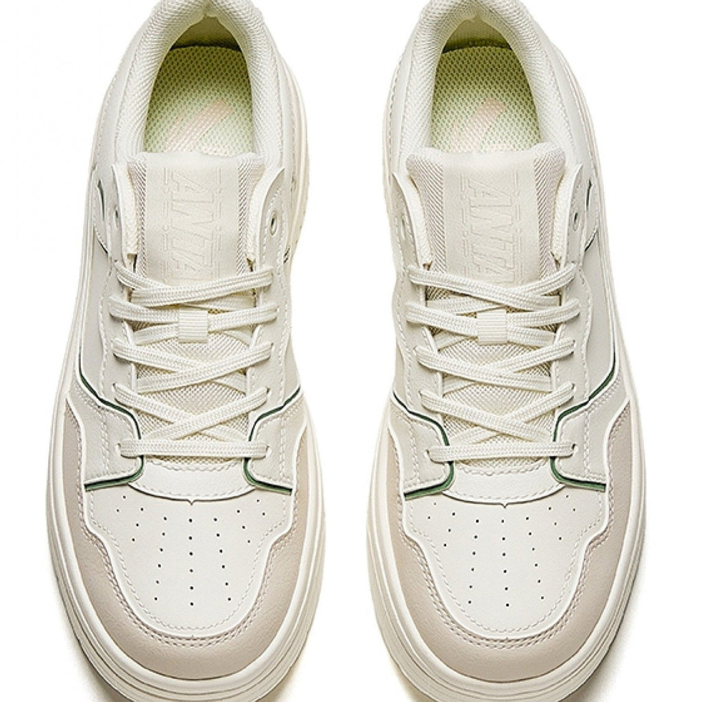White sneakers with a light sole on a white background