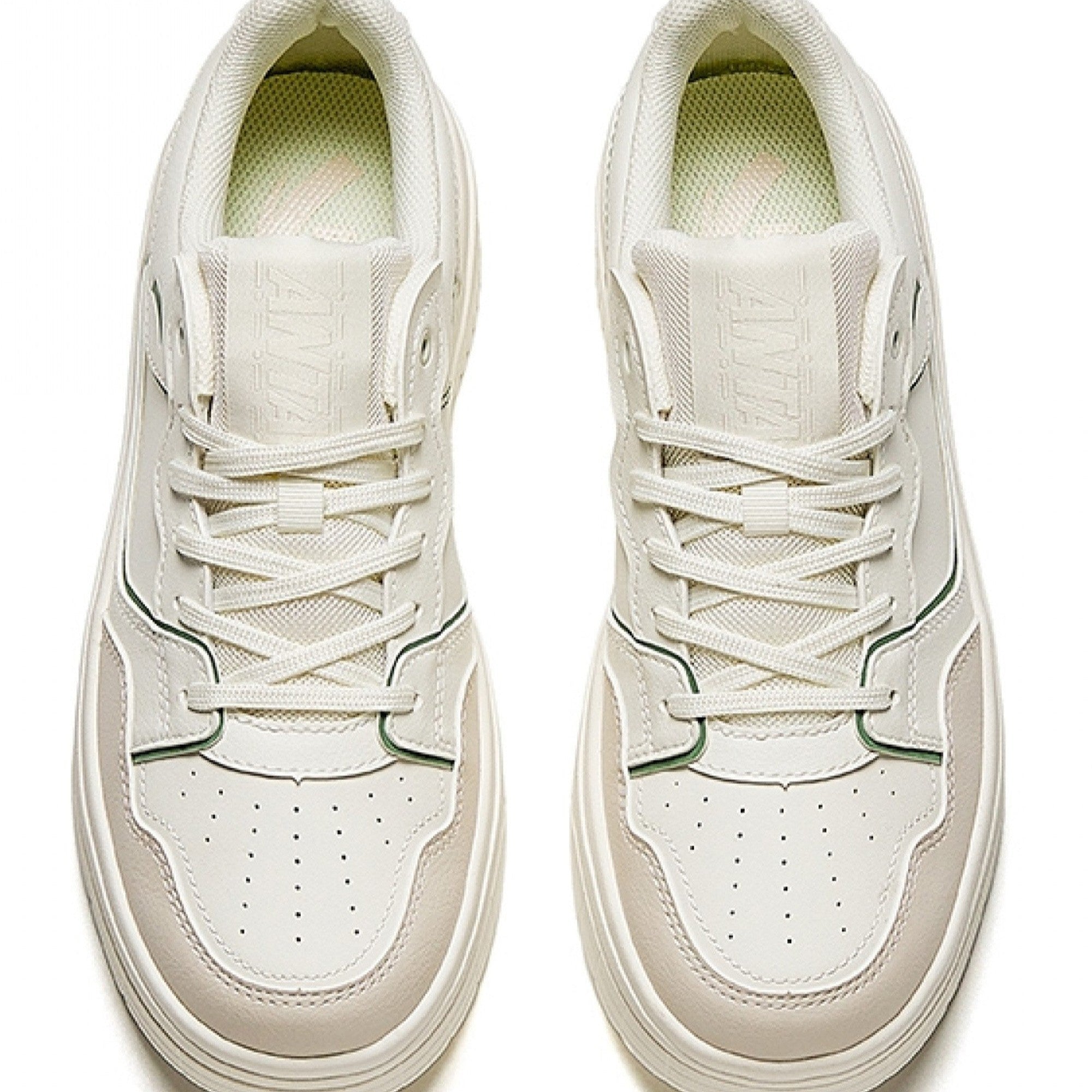 White sneakers with a light sole on a white background