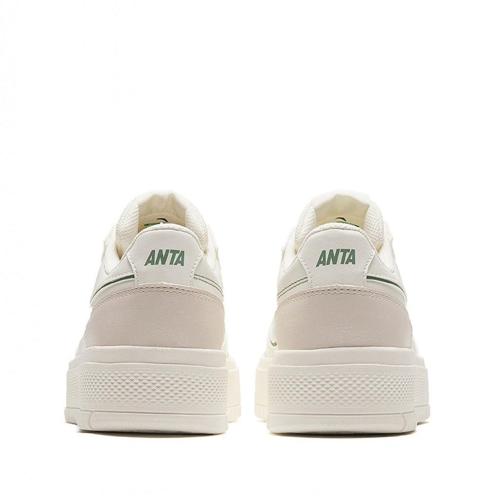 Pair of beige sneakers with 'ANTA' branding on a white background